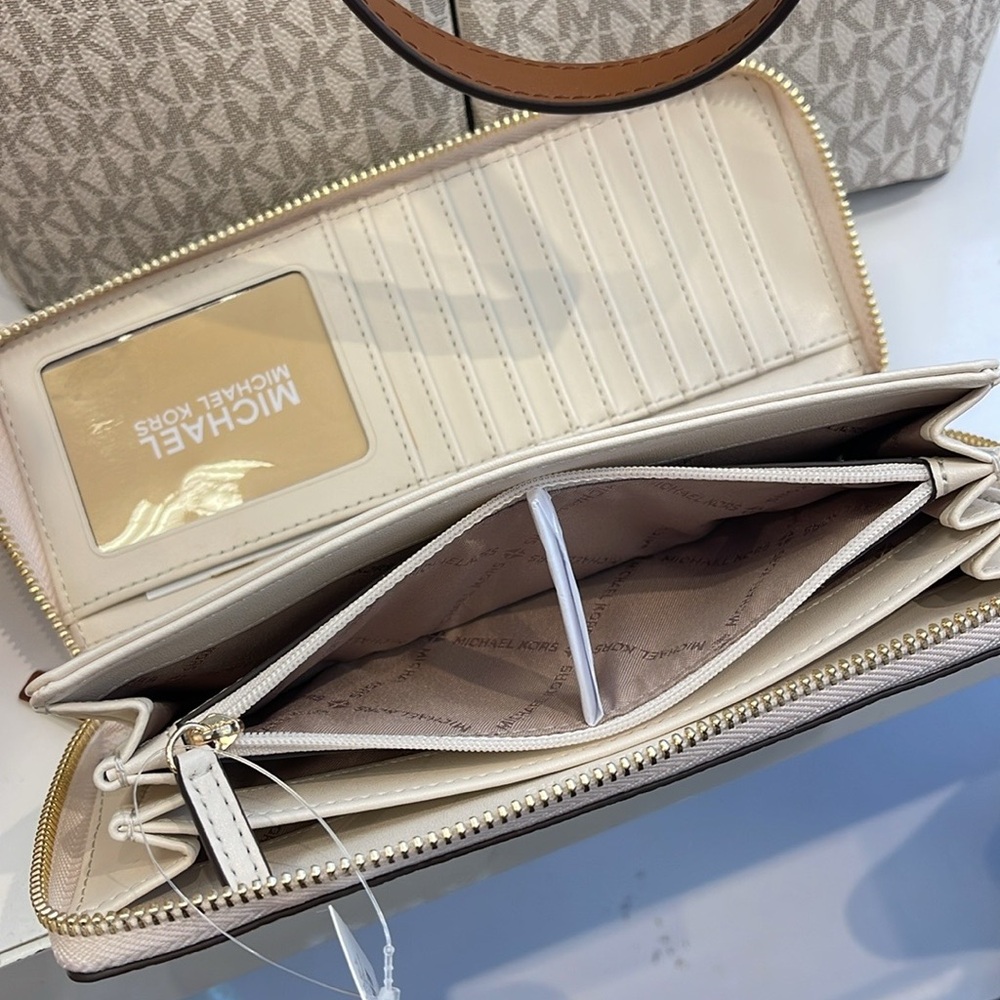 MICHAEL KORS
Leather Continental Wristlet Phone Case Wallet 
Light Cream 
NWT - Picture 12 of 16